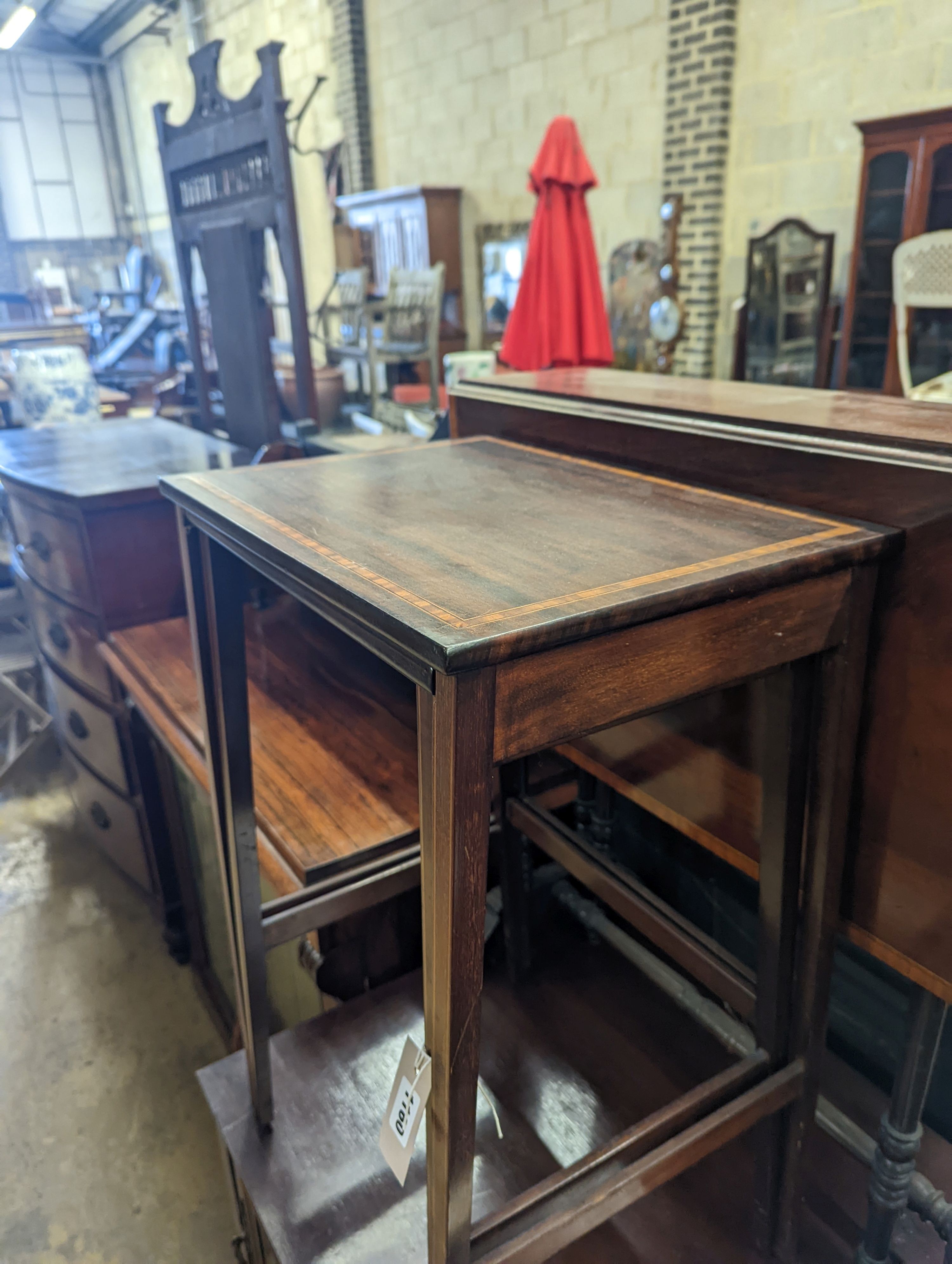 An Edwardian satinwood banded Sutherland table, width 68cm, height 72cm, nest of two tables and a wash stand